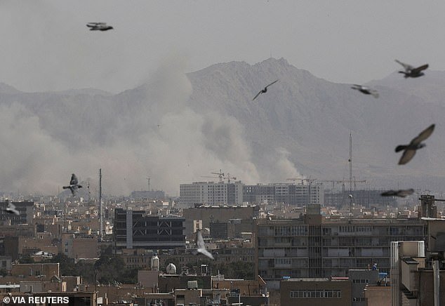106752747-15601557-Smoke_can_be_seen_rising_over_Tehran_Iran_Saturday_morning_after-a-46_17722955047.jpeg