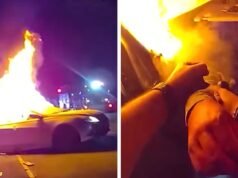 Un oficial de policía saca a una mujer de un vehículo en llamas después de un accidente de robo, muestra un video
