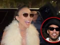 Jeannie Mai Demure sobre Anderson .Paak mientras asiste a su fiesta en un restaurante