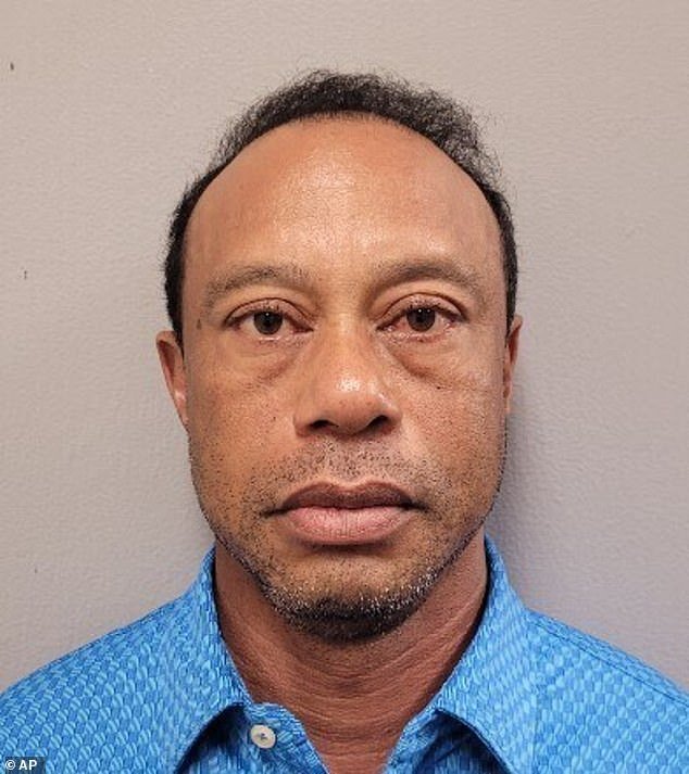 107486905-15688927-A_humiliated_Tiger_Woods_stares_down_the_lens_for_his_mugshot_af-a-1_177478625585.jpeg