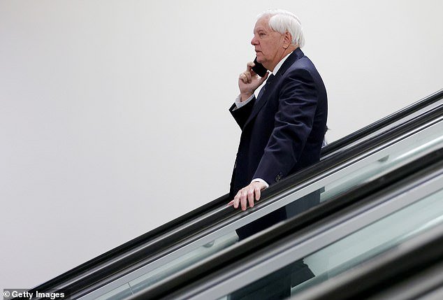 107530655-15691583-Lindsey_Graham_speaks_on_the_phone_as_he_walks_through_the_senat-a-16_17748883478.jpeg