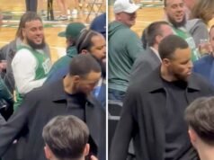 El brazo de Steph Curry tirado por un fanático de los Celtics durante el juego, captado por la cámara