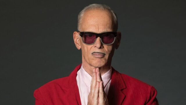 John-Waters-praying-in-red-copy.jpg