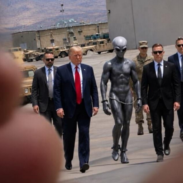 108691287-15827541-The_President_and_bodyguards_flank_the_handcuffed_extra_terrestr-a-2_177911412419.jpeg