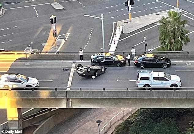 108739679-15833221-A_car_was_seen_on_its_roof_above_in_the_southbound_lane_of_the_W-m-12_17792590253.jpeg